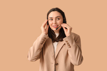 Canvas Print - Female technical support agent in headset on brown background