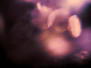 Wall Mural - colorful light leak on dark background. cinematic visual lens effect for design and creative ideas. 