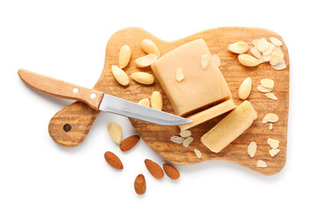 Poster - Wooden board with marzipan bar, almond nuts and knife on white background