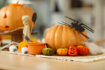 Poster - Halloween pumpkins on dining table in room, closeup