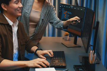 Wall Mural - it developers discussing with point to intelligent website development coder system running data onl