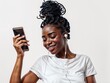 © 3DLeonardo - African-American woman smiling while holding a cellphone, communicating and looking confident
