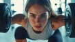 © Ket - Focused woman lifting heavy weights in gym, intense strength training session, sport concept