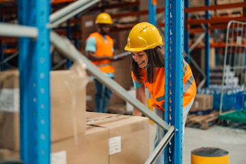 Woman inspects warehouse storage with attention to inventory detail