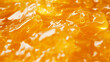 © Ice Cream Paradise - a close-up, top-down view, texture background of apple jam spread across the entire frame, filling the image with its golden amber color and smooth texture