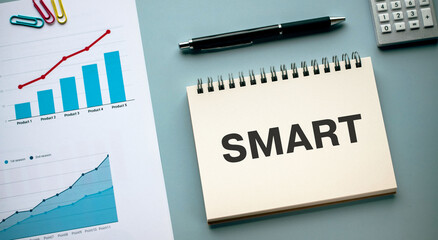 Wall Mural - There is notebook with the word SMART. It is as an eye-catching image.