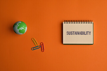 Wall Mural - There is notebook with the word Sustainability. It is as an eye-catching image.