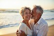 © Derek Brumby - A senior couple captured sharing laughter while walking by the ocean waves. Their genuine smiles and warmth illustrate a loving, harmonious companionship.