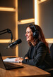 © Derek Brumby - A confident woman hosts a podcast from her modern workspace featuring a professional microphone as she shares insights, creating engaging audio content in a focused ambiance.