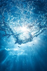 Wall Mural - sunlight shining through the surface of clear blue water creating bubbles background for advertiseme
