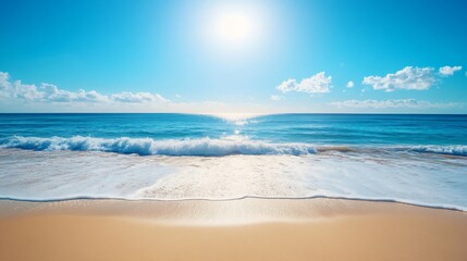 A wave breaks on a sandy beach, with the bright sun and blue sky overhead.