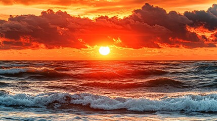 Wall Mural - Dramatic sunrise over the ocean with a fiery sky and dark clouds.