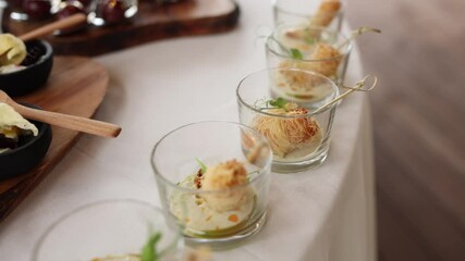 Poster - snacks on the buffet table in glasses in the restaurant