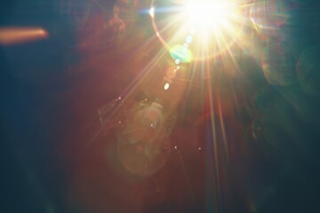Wall Mural - Sun rays burst through lens flare