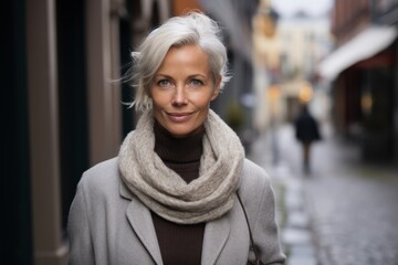 Wall Mural - Portrait of a middle-aged woman in a city street.