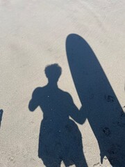 surfer silhouette on the beach during summer