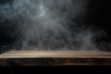 Empty wooden table with misty smoke on a black background
