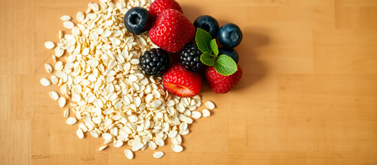 Wall Mural - Fresh Berries and Oats on a Wooden Surface