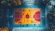 © Tetiana - People playing basketball on urban court with green surface aerial view