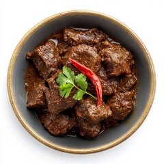 Wall Mural - Indonesian traditional beef rendang isolated on white background.