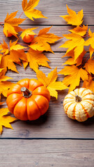 Poster - Orange and White Pumpkins with Autumn Leaves on a Wooden Background