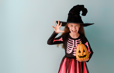 Canvas Print - girl in witch costume with Halloween pumpkin