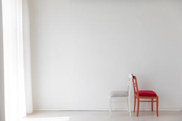 Canvas Print - two vintage chairs in the interior of an empty white room with a window