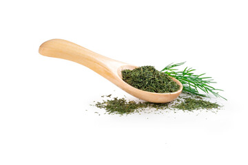 Dried organic dill in a wooden spoon on a white background with fresh dill leaves. Seasoning for cooking in the kitchen