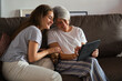 © ADDICTIVE STOCK - Mother and daughter enjoying time together with a tablet
