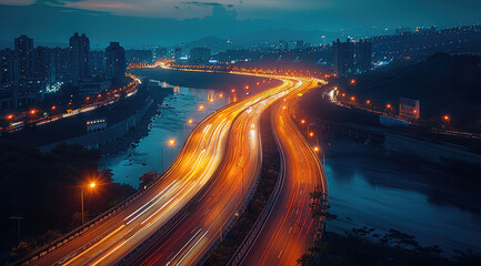 Poster - Aerial view of a busy highway at night, headlights and taillights of cars create a flowing stream of light. The road is illuminated by street lights and the surrounding area is dark.