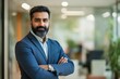 © Vlad - Indian Businessman Portrait. Confident Leader in Modern Office. Successful CEO Manager