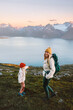 © EVERST - Family vacations: mother and child hiking in mountains together active healthy lifestyle outdoor in Norway, woman walking with daughter having fun happy candid emotions, Mothers day