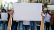 © Mirjana - Community members holding blank signs during a peaceful demonstration for social change in a vibrant urban setting