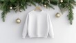 © Viktoriia Kan - A blank white sweatshirt hangs on a wooden hanger, perfectly situated against a vibrant Christmas tree adorned with ornaments, capturing the spirit of the holiday season
