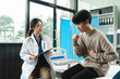 © NINENII - doctor consulting patient filling form at consultation, talking to patient filling signing medical paper at appointment visit in clinic.