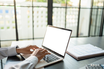 Wall Mural - business man using laptop blank screen computer working in office mockup image blank screen computer