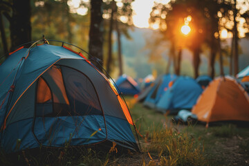 A group of people set up tents to sleep near a music festival.