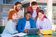© Raquel - Group of students, meet on university campus work together on creative tasks, prepare for university exams, use laptop. Education, study of university life concept.