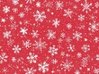 © TheosArtTavern - A red background with white snowflakes scattered all over it
