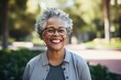 © Vorda Berge - Smiling portrait of a African American female senior professor in library