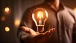 © Designpro - Business entrepreneur hold energetic yellow light bulb in hand. Symbol of innovation growth idea creativity technology power