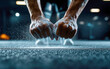 © Dadee - Close-up of strong hands gripping the ground, showcasing determination and strength in a fitness training setting.