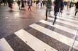 © themorningglory - Blurred buisness background of people walking cross Shibuya Crossing intersection road