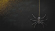 © Carla Tracy - Hanging black glitter spider decoration for halloween, dark grunge gold glitter background, spooky, minimalist night scene, creepy insect suspended in air, space for text copy, festive holiday themes