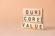 © Rochu_2008 - Symbol of our core values. Concept words Our core values. inscription on wooden blocks. Beautiful background. Concept of business and our core values. Copy space