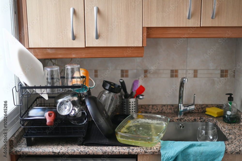 clean dishes in the dish rack and dirty dishes in the sink Stock Photo ...