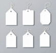 © Mahmud - Set of Blank Price Tags with Strings on a Gray Background
