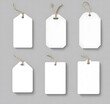 © Mahmud - Set of Blank Price Tags with Strings on a Gray Background