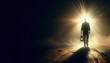© osmanpek - A man walking from darkness to light with an old lantern in his hand