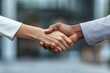 © Visual Odyssey - Multiethnic coworkers greeting each other near office building. Closeup of business man and woman shaking hands outside. Teamwork concept, Generative AI